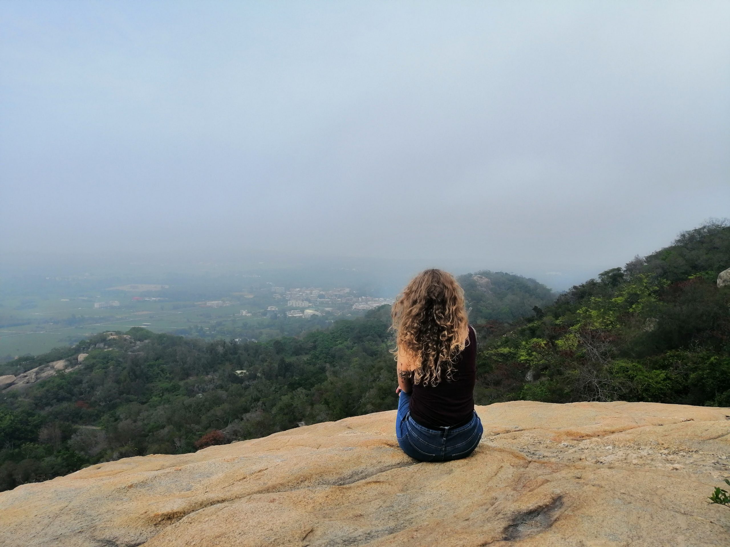 An Expat in Taiwan Sits on Tawu Mountain on Kinmen Island. 