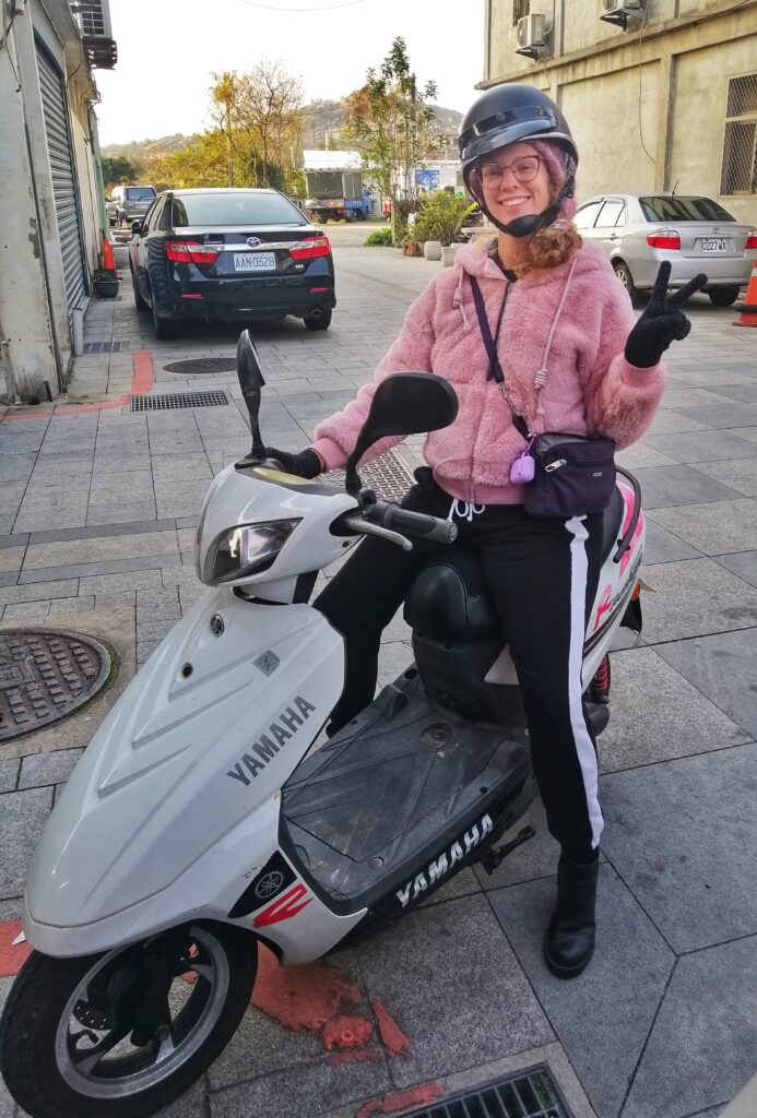 girl on scooter in taiwan move to teach english in kinmen