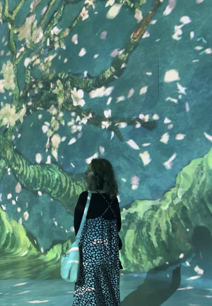 frameless museum in london standing in front of display