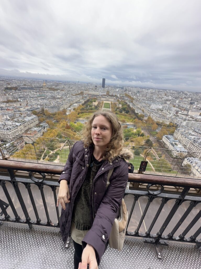 Standing over Paris on 2nd floor of the eiffel tower