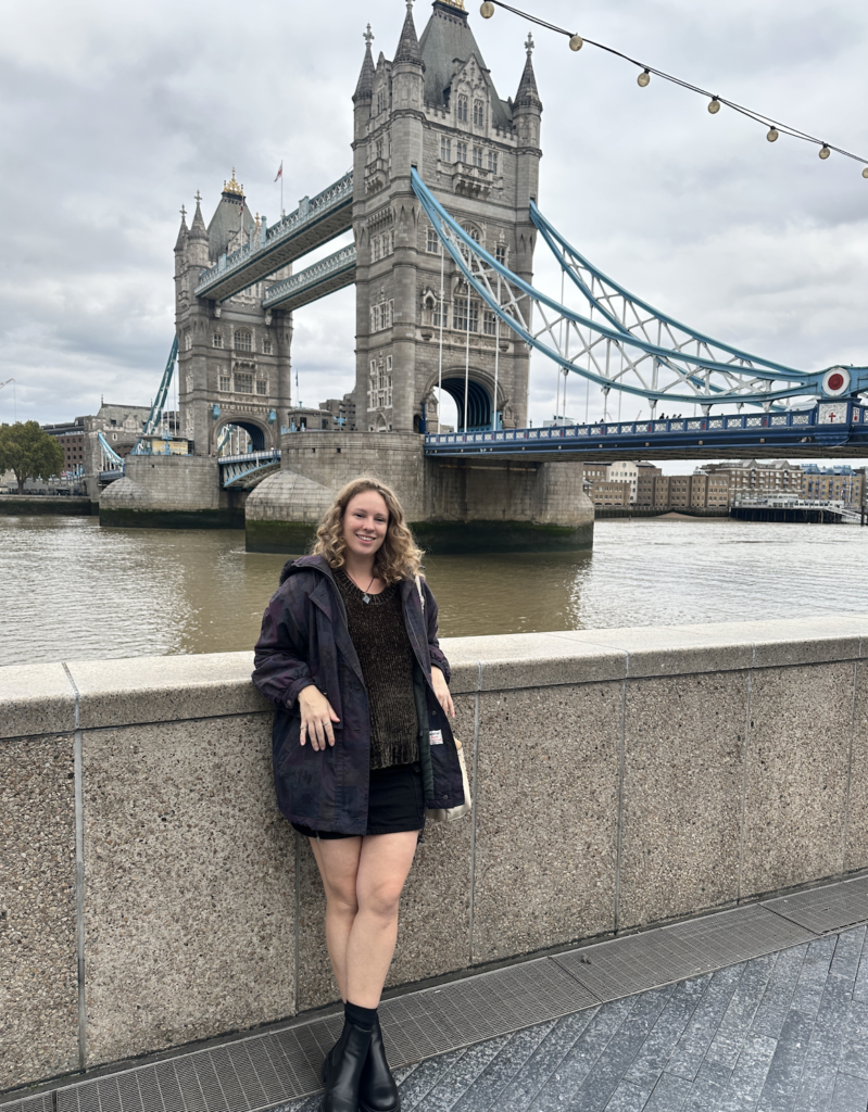 girl standing at london bridge in the uk by the river thames