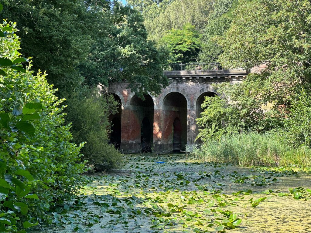 inconic bridge at hampstead health in london with the view of the pond