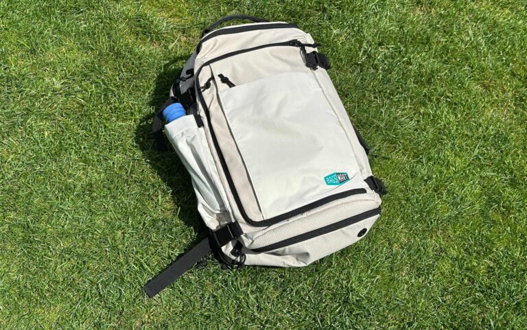 bag smart blast pro 38 liter expandable backpack sitting in the grass