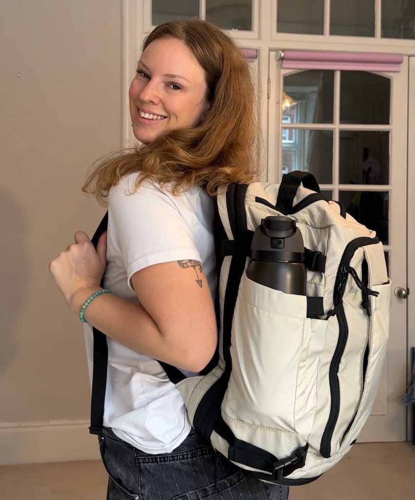 girl wears bagsmart pro 38 liter backpack with waterbottle holder