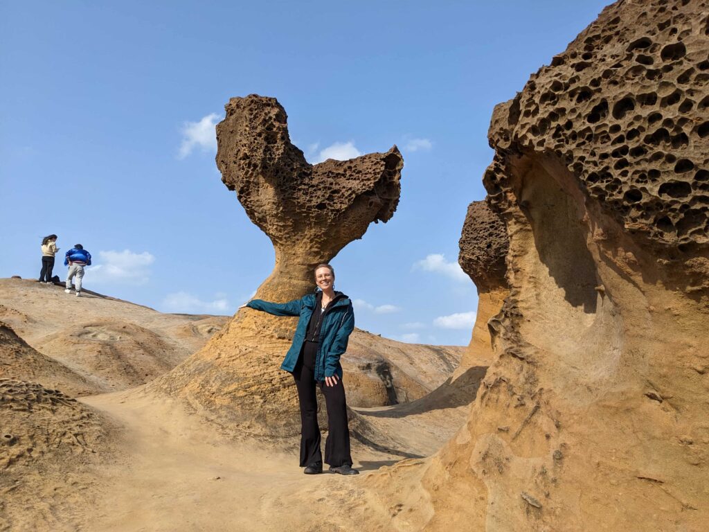 yehliu tourist stands on space rocks on day trip from taipei taiwan