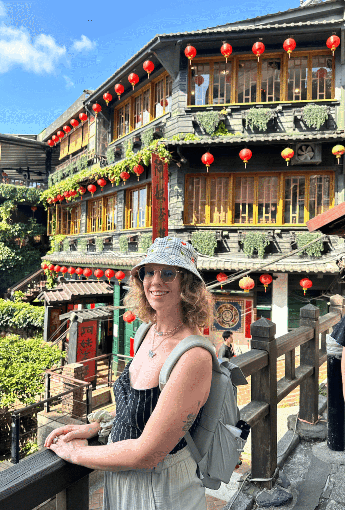 jiufen day trips from taipei taking photo with iconic lanterns
