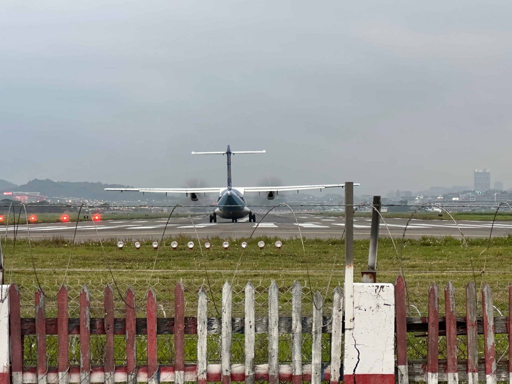 plane lands at songshan airport in taipei taiwan