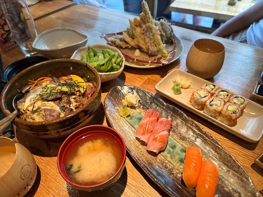DOZO Sushi table set up with donburi, toro nigiri, tempura and miso soup one of the best japanese places to eat in London