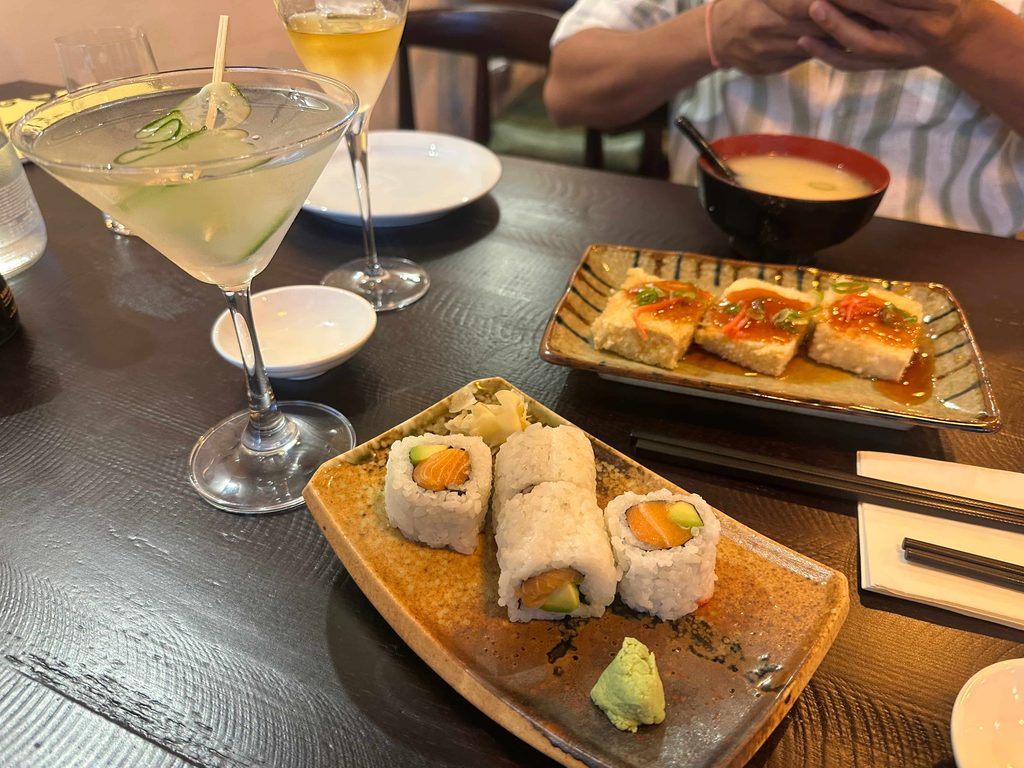 plate of sushi , a cocktail, and miso soup at Taro Japanese restaurant in London with 3 locations