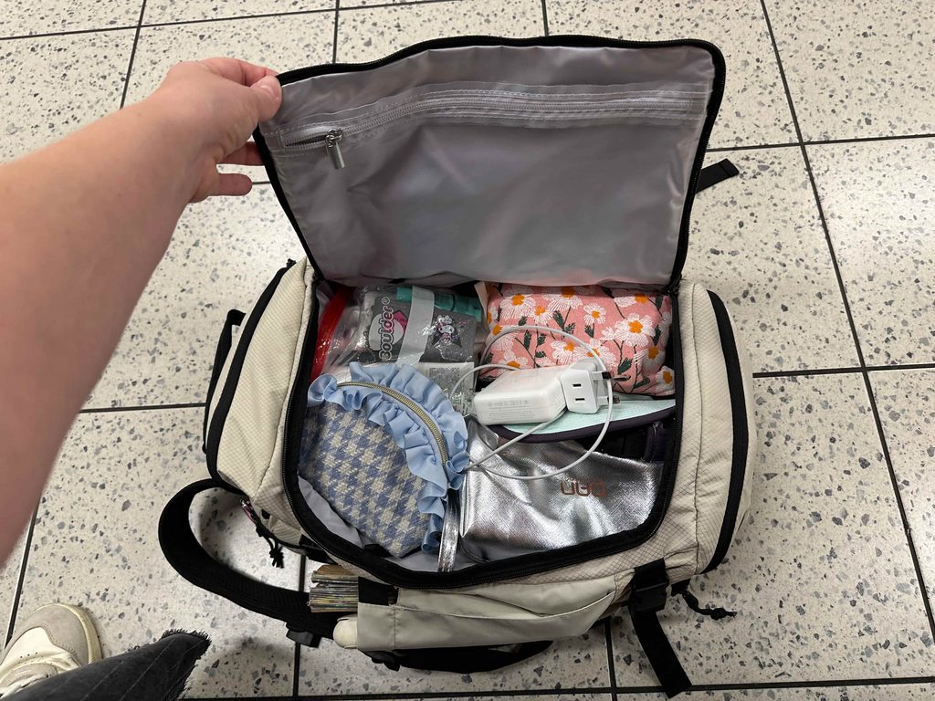 interior of bagsmart blast 38 liter pro while traveling using as a under the seat backpack