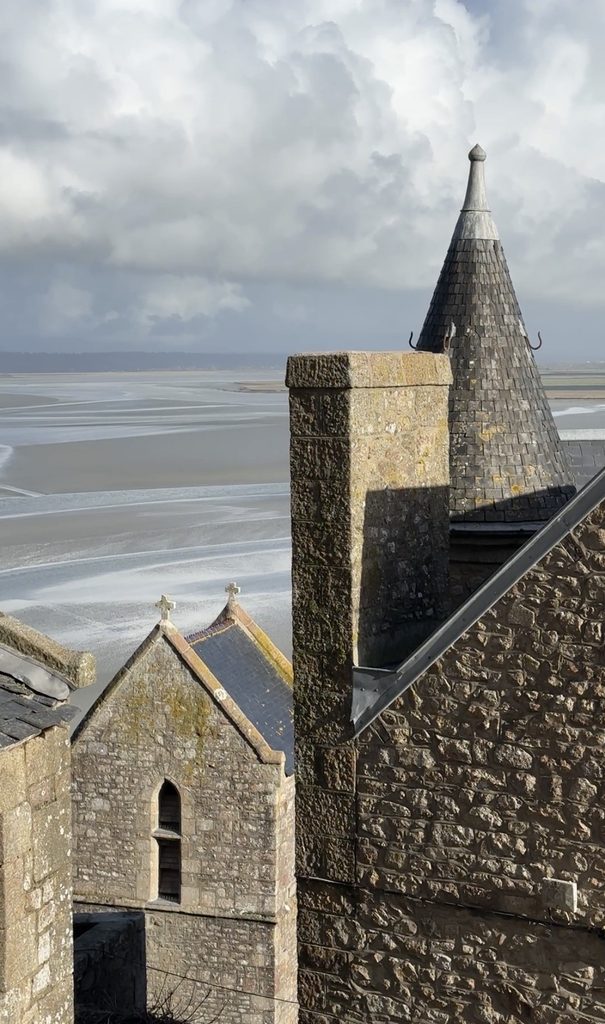 medieval architecture at Mont Saint-Michel close up of buildings overlooking the water