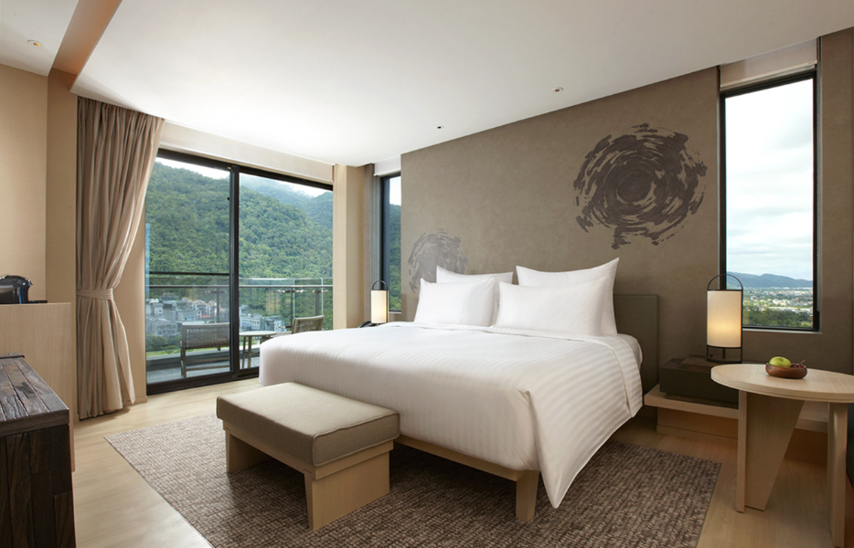 hotel spring hotel in Taiwan at MU in Jiaoxi room with large windows and mountain views
