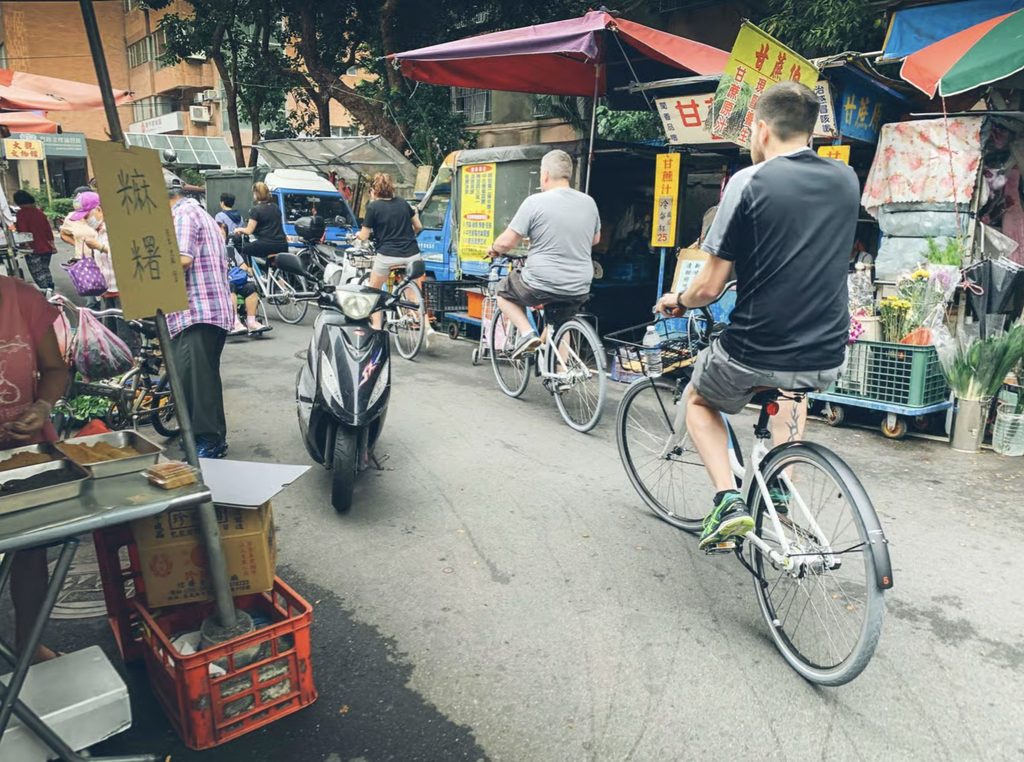cycling through a Taipei market on unique local tour