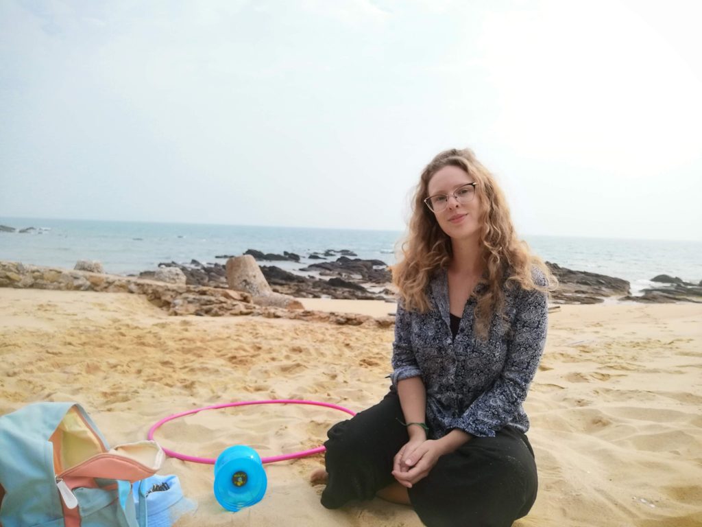 woman sits on the beach in kinmen in shanwai