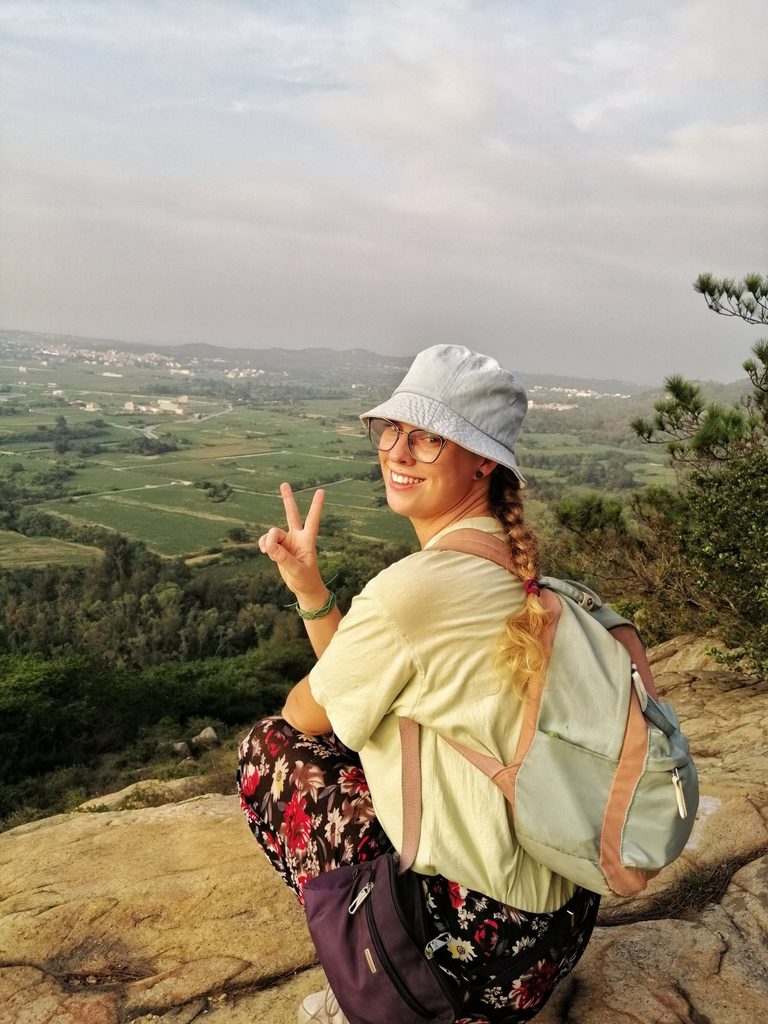 girl sitting over kinmen island on a hike
