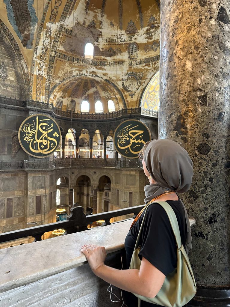 girl stands inside the hagia sofia one of the best things to do in istanbul for first timers