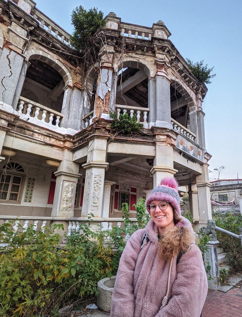 girl stands outside western mansion on kinmen island